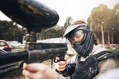 Buy stock photo Paintball, gun and aim with a sports woman training for the military or army during a war and combat game. Exercise, warrior and marker with a female athlete or soldier on a battlefield simulation