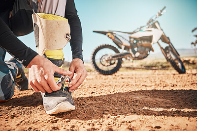 Buy stock photo Extreme, motorcycle and man tying laces in nature for adventure, holiday and race in the countryside. Start, travel and biker ready with shoes for a journey on a motorbike on a dirt road for freedom