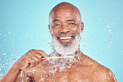 Buy stock photo Water splash, toothbrush and portrait of black man with smile on face, mockup isolated on blue background. Teeth, toothpaste and product placement, senior dental care and cleaning mouth in studio