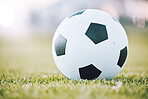 Soccer, ball and field for sports game time or match start in athletics or football tournament in the outdoors. Round sphere object with pentagon shape spots on green grass for sport on mockup