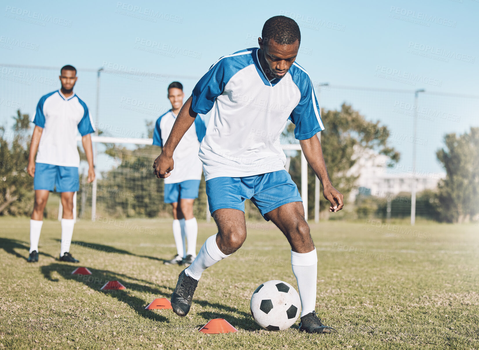 Buy stock photo Sports, soccer and black man training with ball for practice, playing game and exercise on outdoor field. Motivation, energy and male football player kick, running and score goals for fitness workout
