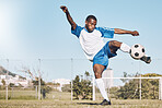 Sports, soccer and black man kick ball playing game, training and exercise on outdoor field. Fitness, workout and male football player in action, running and score goals, winning and competition