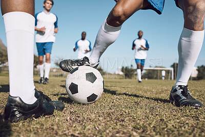 Fitness, soccer team and athletes playing on the field at a game competition, league or championship. Sports, football and male sport players running with a ball at an outdoor match on soccer field.