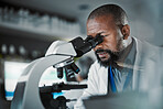 Black man scientist, microscope and lab analysis in biodiversity study, vision and research data for innovation. Agriculture science, studying microbiome and laboratory with focus for future goals