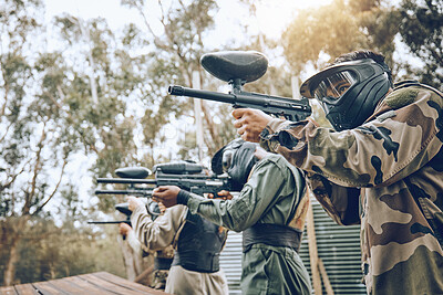 Buy stock photo Team, paintball and shooting range for target practice in preparation for extreme sports match or game outdoors. Group of people, soldiers or army aiming to shoot by training bunker for competition