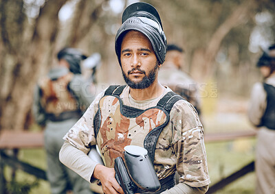 Buy stock photo Paintball, sports and portrait of man with gun in woods ready for game, arena match and shooting battle. Training, adventure and male with weapon in camouflage, military clothes and action gear