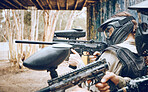 Paintball, gun and target with people, action and sports outdoor, battlefield and soldier, focus during war game. Extreme sport, team aim and military mission, exercise and fitness with motion blur