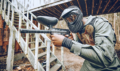 Buy stock photo Paintball, black man and gun with target, sport with fitness and battlefield challenge, war game and soldier outdoor. Safety helmet, extreme sports and exercise, shooting range and military mission