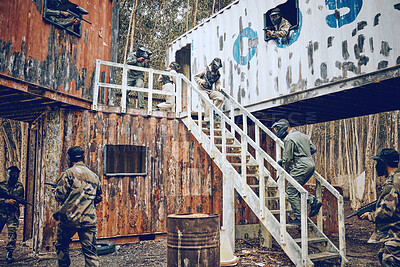 Buy stock photo Paintball, steps or men in a container or shooting game playing with speed, fast or fun action. Mission focus, military or people running in battle with guns for survival in an outdoor competition 