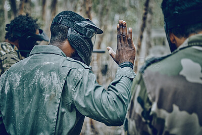 Buy stock photo Hand sign, stop and men in training, paintball and planning, strategy and plan of action outdoor. Military, men and hands by guy leading team in sports, shooting and intense target practice together