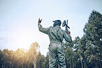 Paintball, rock hand sign or man in a shooting game playing on a fun battlefield with pride. Success, war winner or soldier with weapon or gun for in celebration of winning survival competition 