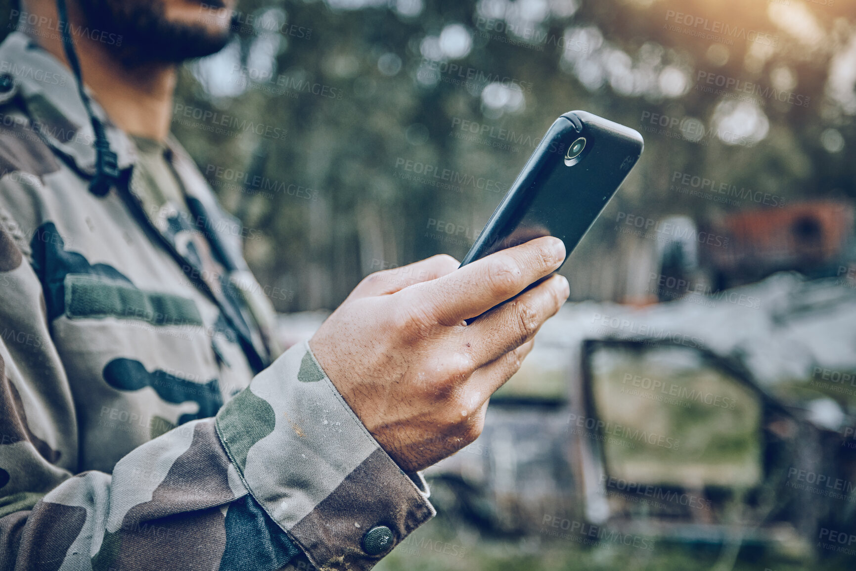 Buy stock photo Military soldier, mobile phone and communication while outdoor for connection, safety and security. Army person with a smartphone for social media, contact or chat on a field, boot camp or at war