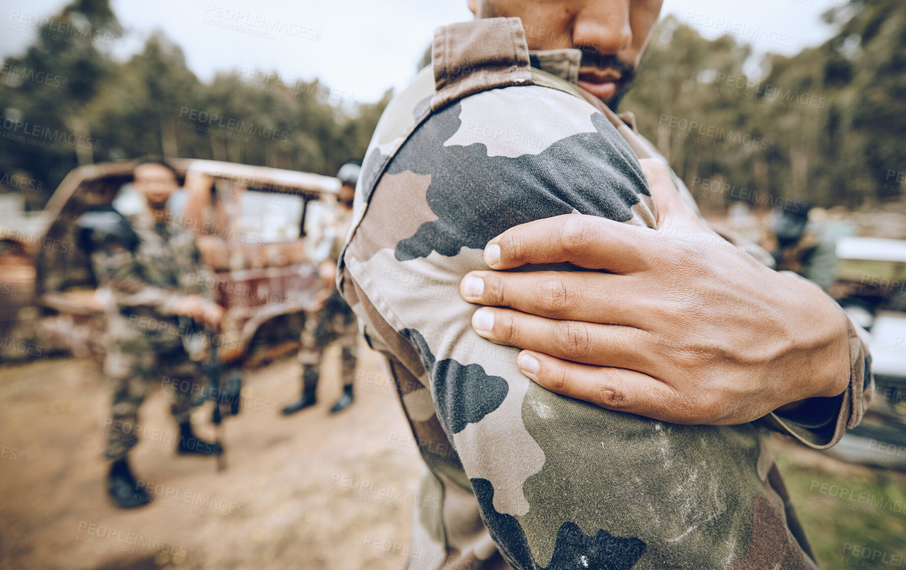 Buy stock photo Injury, paintball and arm pain by man on field for team sport, fitness or training outdoor. Shoulder, problem and hands of guy with issue, arthritis or accident during exercise, match and performance