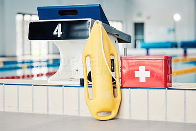 Buy stock photo Swimming pool, medical and lifeguard equipment for water safety, security or emergency for rescue. Safe swim tools for first aid help, protection and lifebuoy in preparation for rescuing or lifesaver