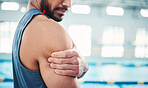 Arm pain, sports and man by swimming pool with injury, muscle ache and body inflammation. Health, medical aid and hands of male athlete with accident or bruise from fitness, exercise or training