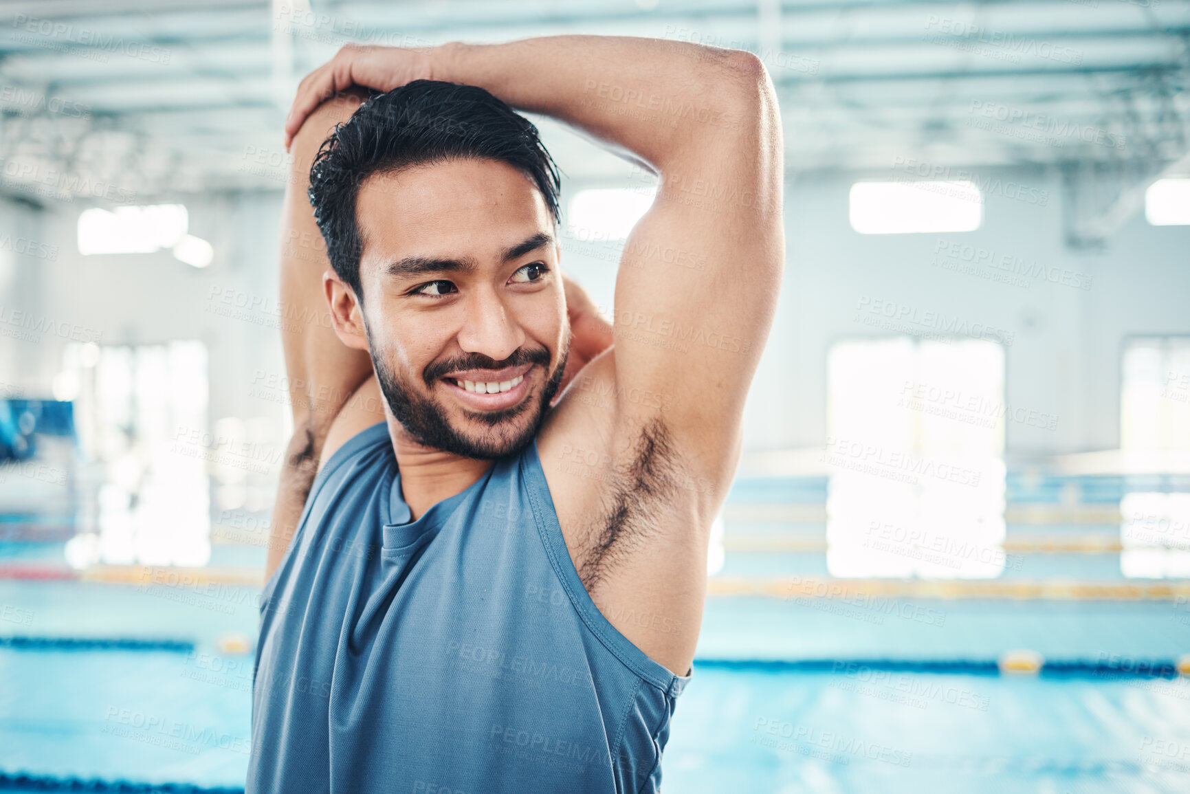 Buy stock photo Happy, man and stretching at a swimming pool for training, cardio and exercise, indoor and flexible. Athlete, smile and swimmer stretch for workout, swim and fitness routine, warm up and preparation