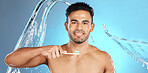 Dental, portrait and man brushing teeth in water splash, studio and mockup on blue background. Oral, hygiene and male teeth model with brush for mouth, cleaning and whitening product while isolated