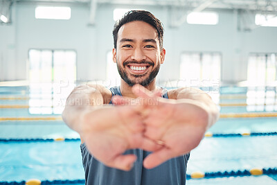Buy stock photo Portrait, stretching and man at swimming pool for training, cardio and exercise, indoor and flexible. Face, smile and swimmer stretch before workout, swim and fitness routine, warm up and preparation