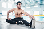 Athlete, fitness and man stretching by a pool ready for training, practice or exercise for a competition. Ready, sport and male swimmer preparing for workout as health, performance and wellness