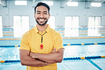 Portrait, proud and coach at a swimming pool for training, exercise and practice at indoor center. Face, happy and personal trainer ready for teaching, swim and athletic guidance, smile and excited 