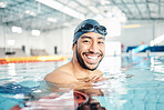 Portrait, man and relax in swimming pool with cap in sports wellness, training or exercise for body healthcare. Workout, fitness and swimmer athlete with happy face, smile or water competition goals