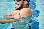 Man in swimming pool, athlete with injury and shoulder pain, fitness with sport accident and muscle ache during workout. Water sports, stroke mistake and swimmer, exercise and problem with arm 