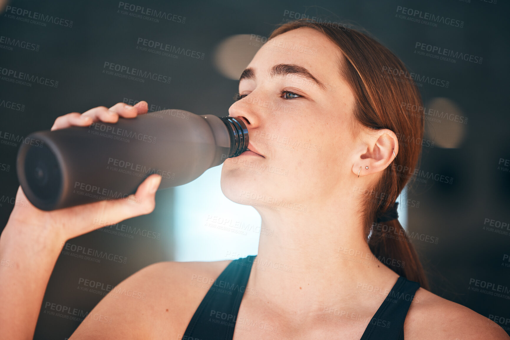 Buy stock photo Fitness, hydration and female athlete drinking water for thirst, wellness and health in a training studio. Sports, energy and young woman enjoying a healthy cold beverage after a workout or exercise.