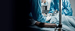 Surgery, teamwork and doctors in a hospital for an emergency life saving operation on a critical patient. Doctor, nurse and medical with a medicine surgeon group working in a clinic operating room