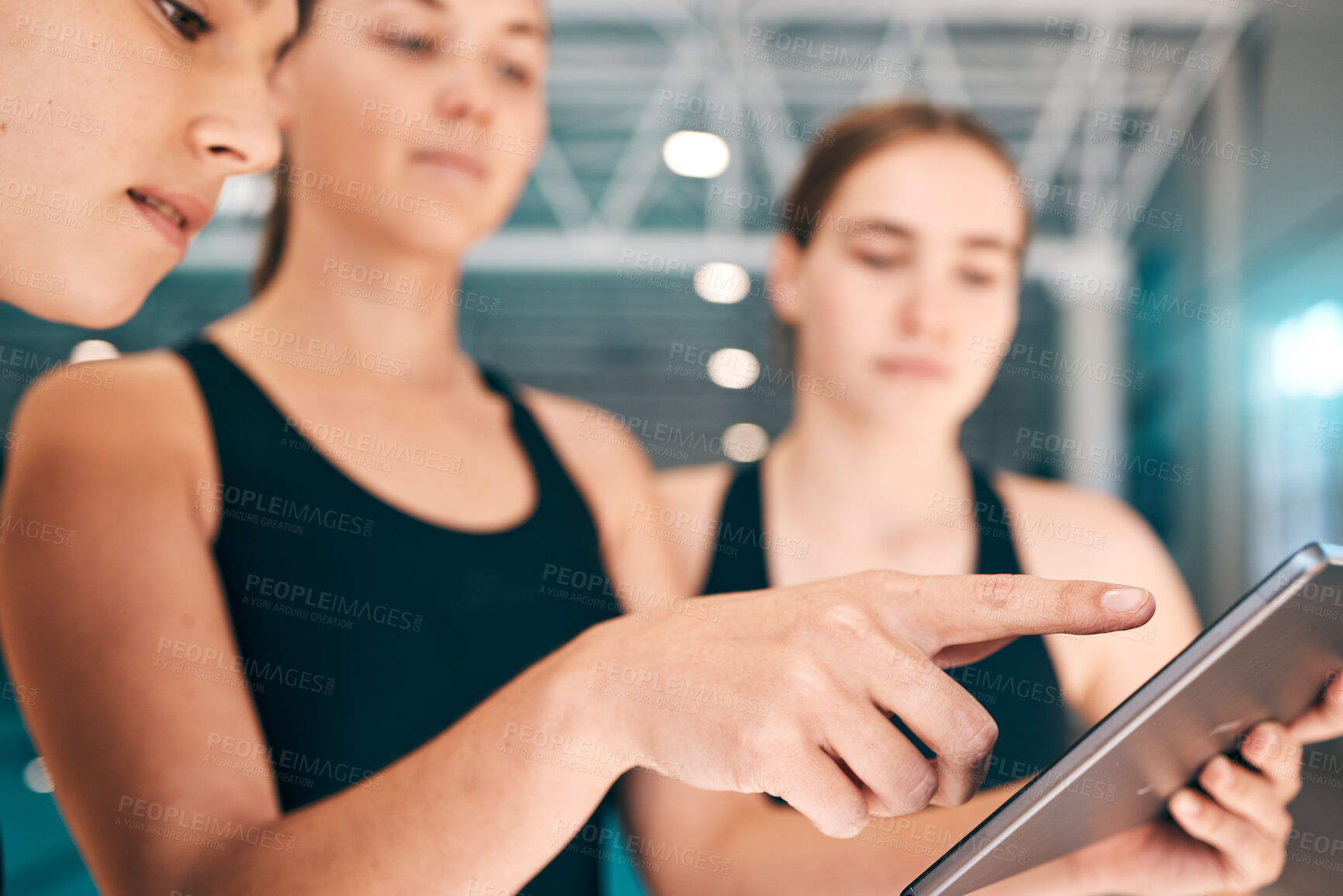 Buy stock photo Young athletes looking at tablet, training data for sports with technology and group of people at indoor swimming pool. UX of digital workout, swimmers learning from teacher and performance analytics