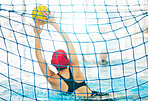 Swimming pool, sports and girl by net for water polo catch ball for goal, winning game or match and competition. Professional sport, teamwork and female athlete in training, exercise and practice