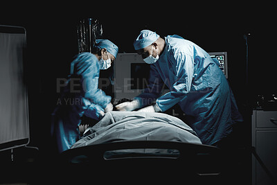 Buy stock photo Healthcare, medical and team of surgeons doing surgery on a patient for an emergency operation in the hospital. Collaboration, group and doctors operating in a surgical room in the medicare clinic.