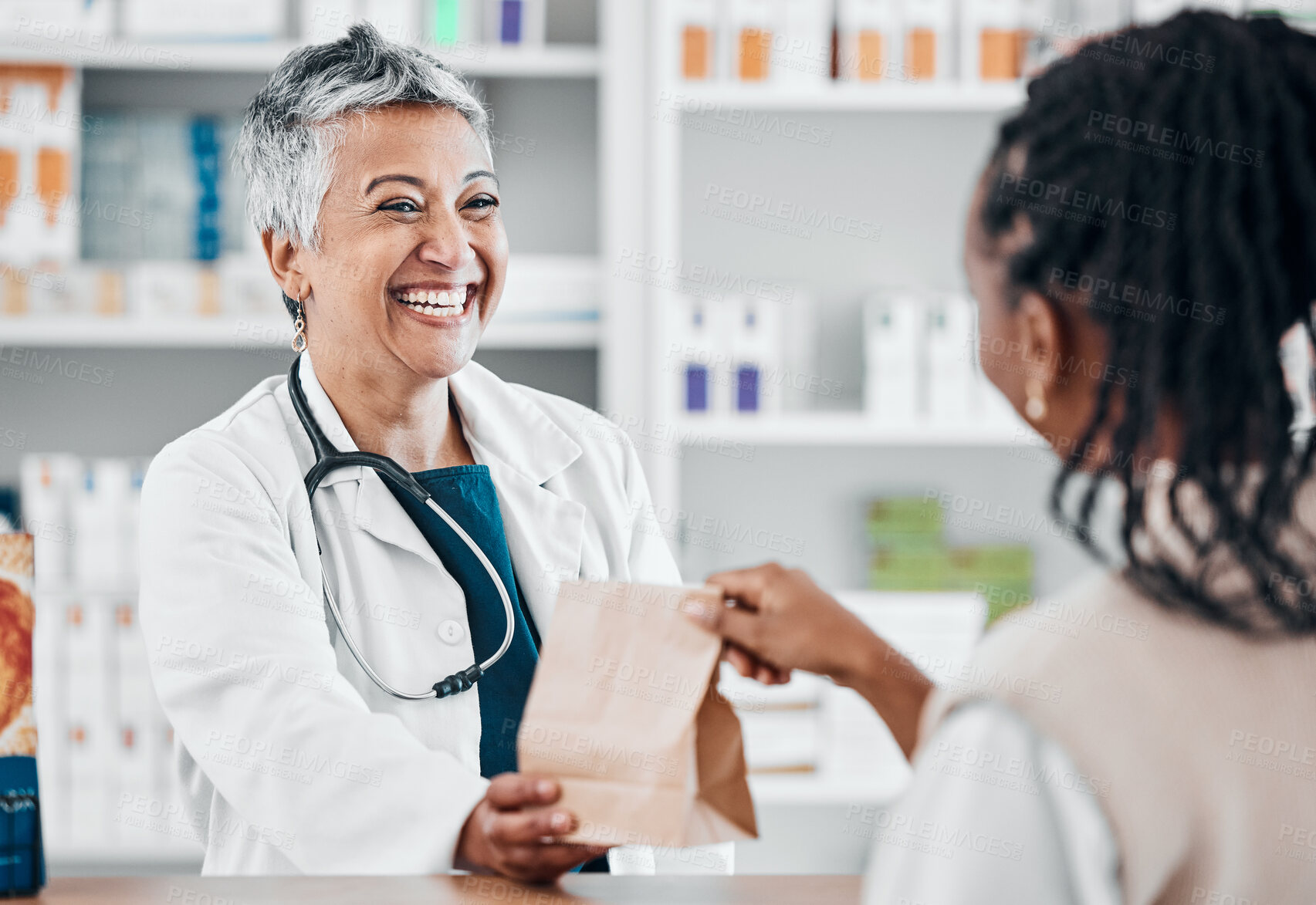 Buy stock photo Happy senior pharmacist with medicine for a black woman for retail healthcare treatment or consultation. Consulting, trust or mature doctor helping a customer shopping for medicine, pills or drugs 