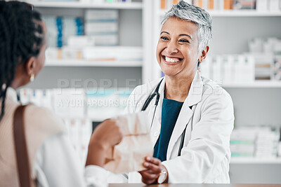 Buy stock photo Senior pharmacist with pills for a sick black woman in a pharmacy for retail healthcare treatment. Smile, trust or happy mature doctor helping a customer shopping for medication, medicine or drugs