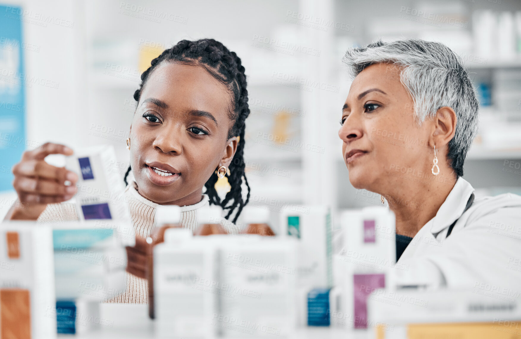 Buy stock photo Pharmacy, medicine and choice by women discussing label, information and questions with pharmacist. Drugstore, service and customer asking senior health expert woman advice, help and instructions 