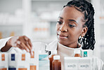 Pharmacy shelf, medicine and black woman with pills, supplements and medication for wellness in clinic. Healthcare, pharmaceutical store and pharmacist check drugs, vitamins and medical products