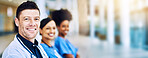 Healthcare, portrait of doctor and nurse team, confident to help with leadership and motivation in hospital or clinic. Diversity, teamwork and man with women medical workers standing together blurred