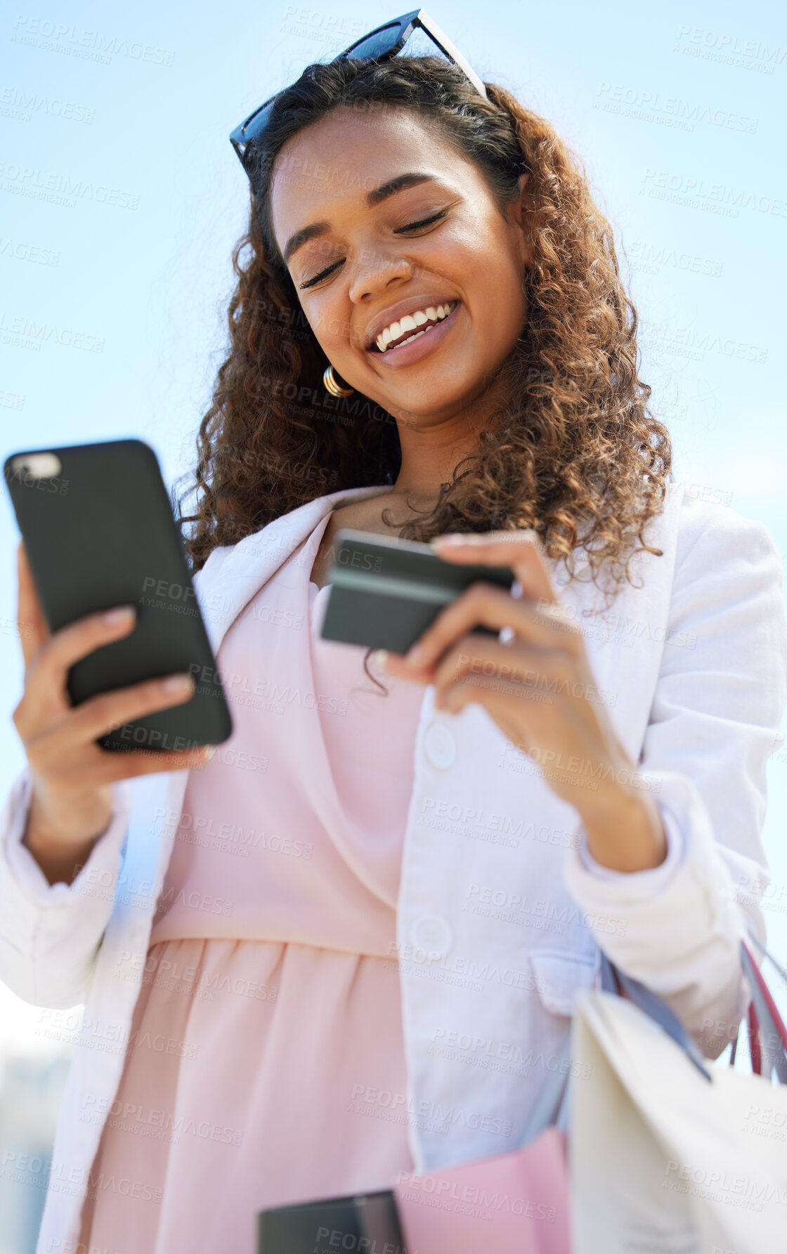 Buy stock photo Phone, credit card and woman in the city doing online shopping, paying debt or on her bank app. Happy, smile and female on a cellphone for a ecommerce retail sale, discount or promotion in town.