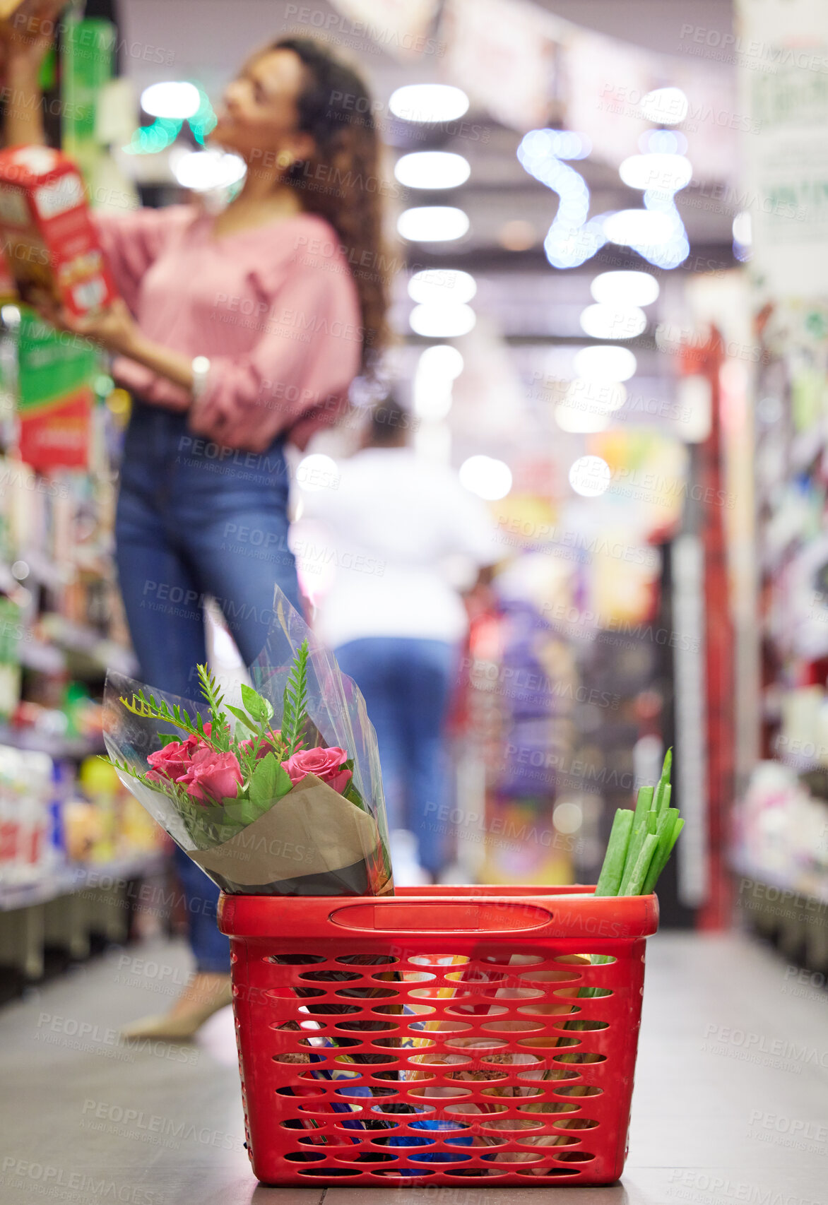 Buy stock photo Shop floor aisle, grocery basket with flowers, black woman or box for choice, sale or discount in valentines promotion. Young african female, low angle and groceries shelf for product deal in store