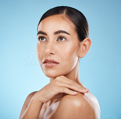 Buy stock photo Shine, cosmetics and woman thinking, luxury and glow with confident girl on blue studio background. Lady with ideas, female and skincare for beauty, dermatology and wellness with makeup and grooming