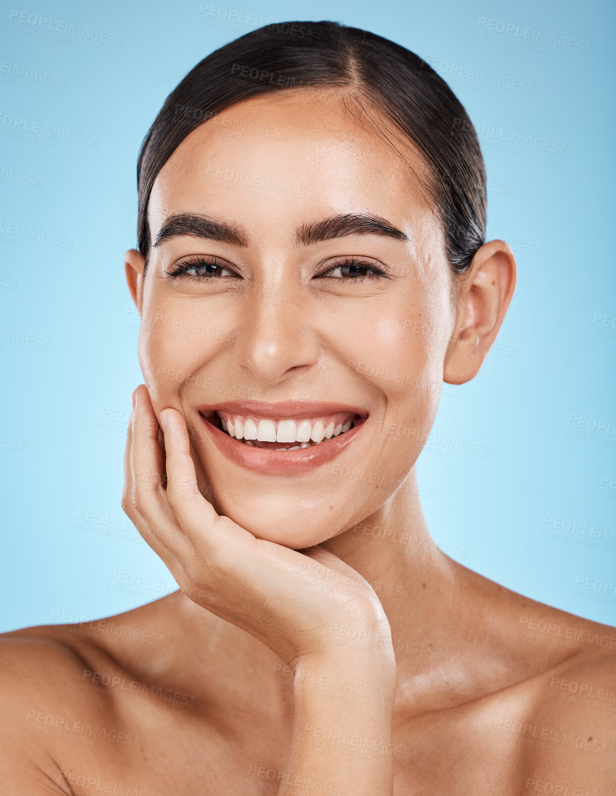 Buy stock photo Wellness, portrait and woman in a studio with a skincare, facial and natural beauty routine. Health, self care and happy female model with a cosmetic face or skin treatment by a blue background.