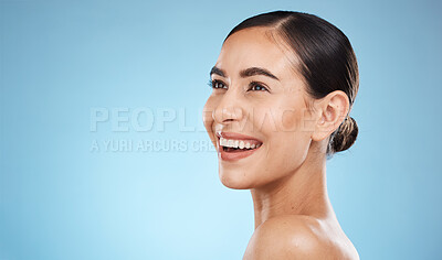 Buy stock photo Happy woman, beauty and isolated on studio background for skincare, cosmetics or makeup with mockup space. Smile on face of model or person with aesthetic, dermatology and facial glow on blue mock up