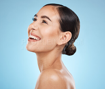 Buy stock photo Skincare, wellness and woman in studio with a healthy, natural and cosmetic face treatment. Beauty, cosmetics and happy female model from Brazil with makeup facial routine isolated by blue background