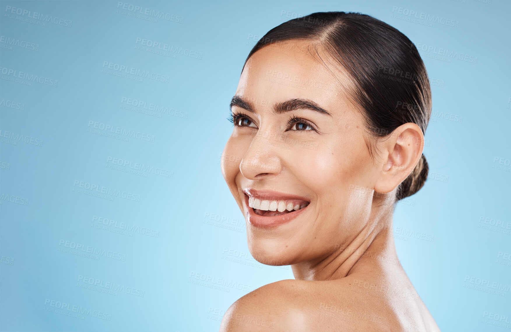 Buy stock photo Skincare, beauty and happy woman in a studio for a natural, cosmetic and face skin treatment. Cosmetics, happiness and female model from brazil with a facial routine isolated by a blue background.