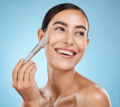 Buy stock photo Cosmetics, thinking and woman with a brush for makeup isolated on a blue background in studio. Skincare, beauty and model happy about cosmetology, foundation and body health on backdrop with a smile