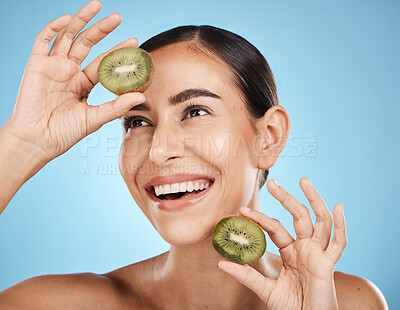 Buy stock photo Kiwi, skincare and woman isolated on studio background for natural beauty, cosmetics and facial product on mockup. Healthy, organic and happy model or person fruits for face, dermatology or vitamin c