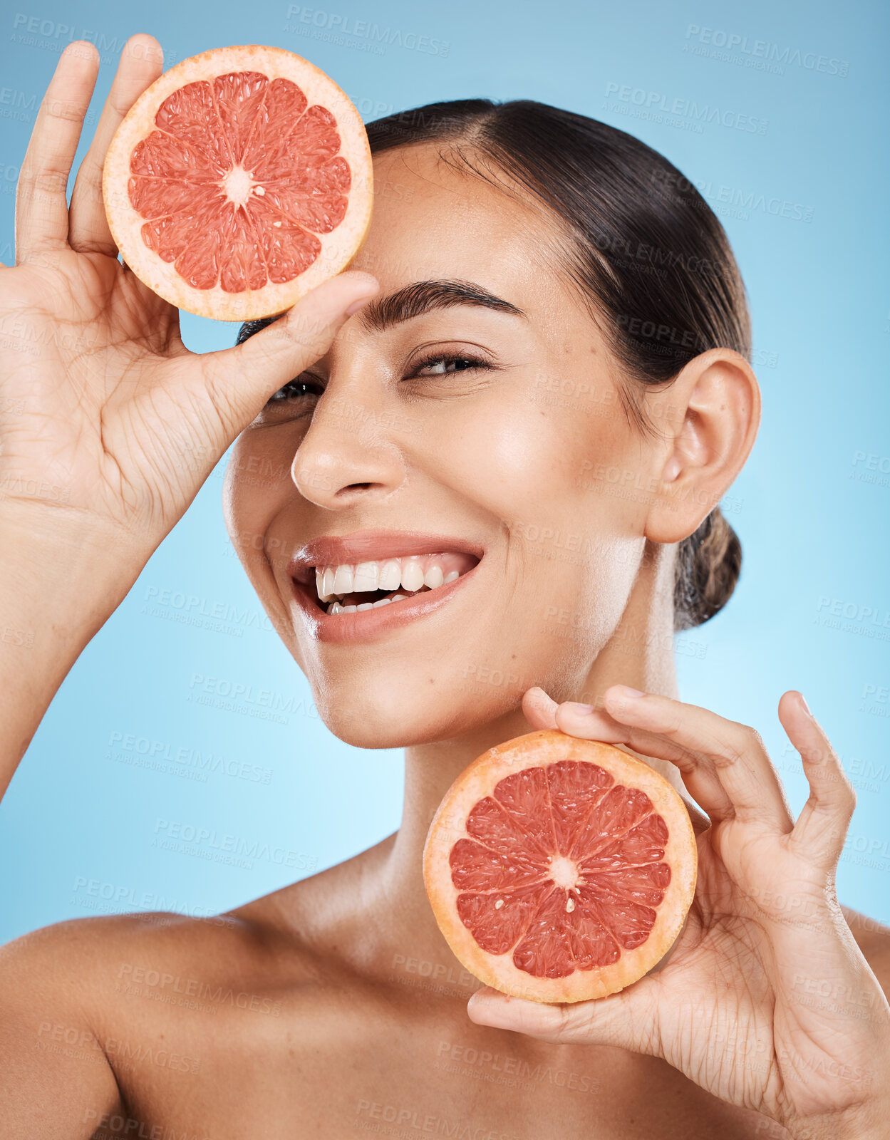 Buy stock photo Portrait, face and skincare of woman with grapefruit in studio isolated on a blue background. Organic cosmetics, food and female model with fruits for nutrition, healthy diet or vitamin c for beauty.