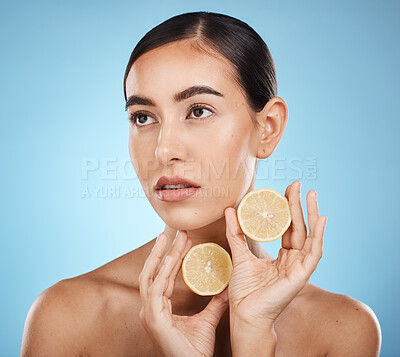 Buy stock photo Lemon skin care, beauty and woman with vitamin c for dermatology, natural cosmetics and wellness. Aesthetic model person for sustainable facial glow, nutrition and detox for face on blue background