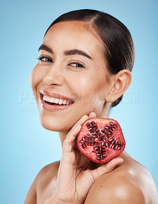 Buy stock photo Pomegranate, skin care and beauty woman portrait with fruit face for dermatology and cosmetics. Aesthetic model person for natural product facial glow, nutrition and healthy smile on blue background