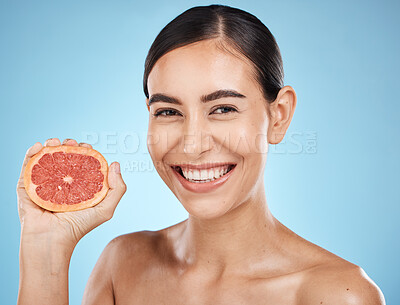 Buy stock photo Beauty, face and grapefruit squeeze woman portrait for dermatology, natural cosmetic and wellness. Aesthetic model person for sustainable facial glow, nutrition diet and skin care blue background