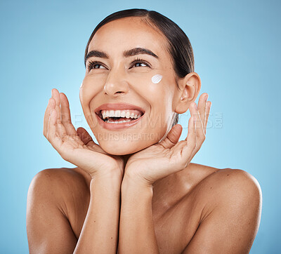 Buy stock photo Beauty cream, skincare and happy face of a woman with hands for dermatology, cosmetics and glow. Aesthetic model with spa natural facial self care for health and wellness on a blue background